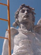 Irakli Chkhartishvili  is a young ,very hard working man from Georgia (Eastern Europe!). His 4.34 m statue made of grey marble showing :  HELIOS ... the ancient greek god of the sun